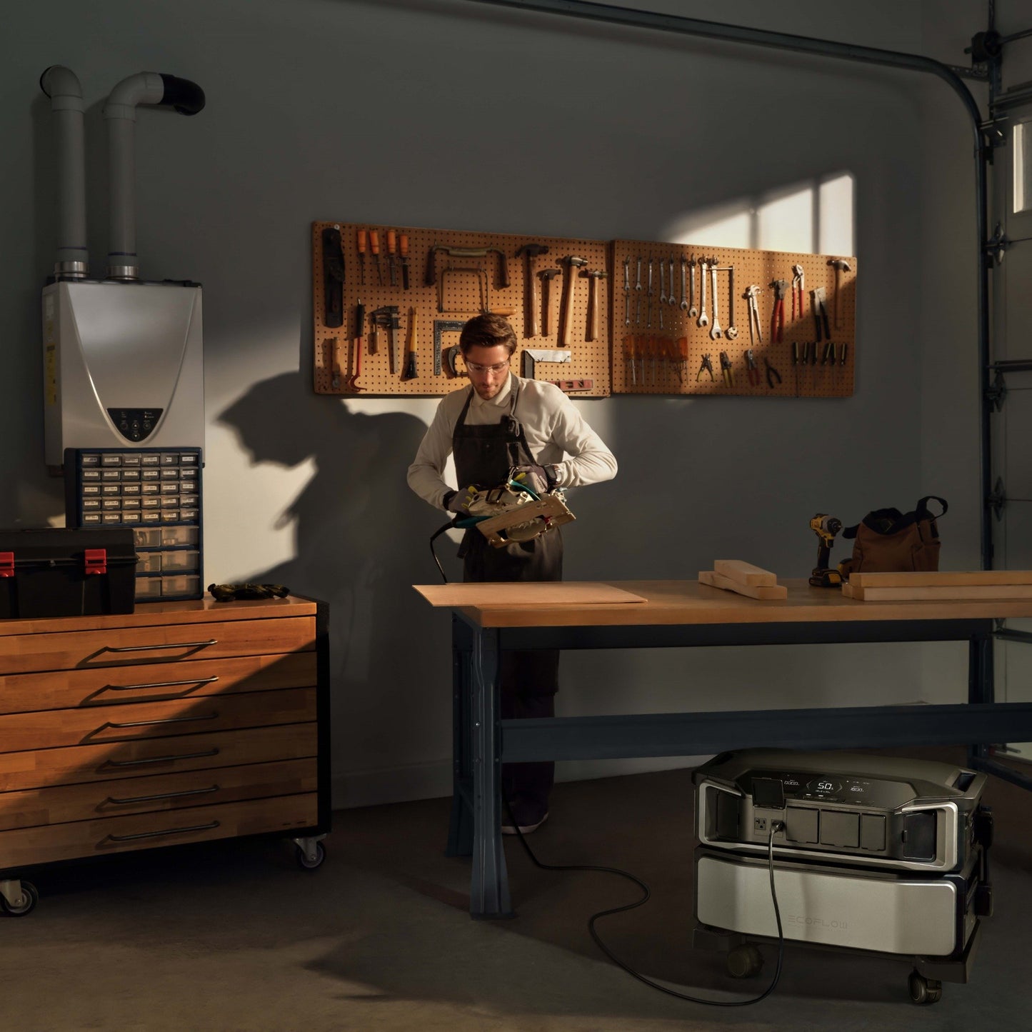 EcoFlow Delta Pro Ultra powering woodworking tools in a workshop as a person operates a circular saw.