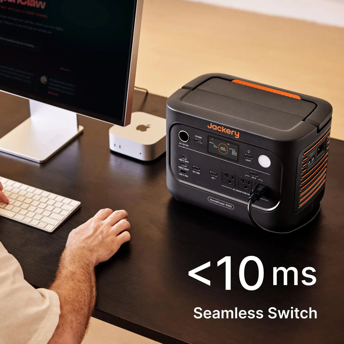 Jackery HomePower 1000 powering a desktop computer setup at a desk