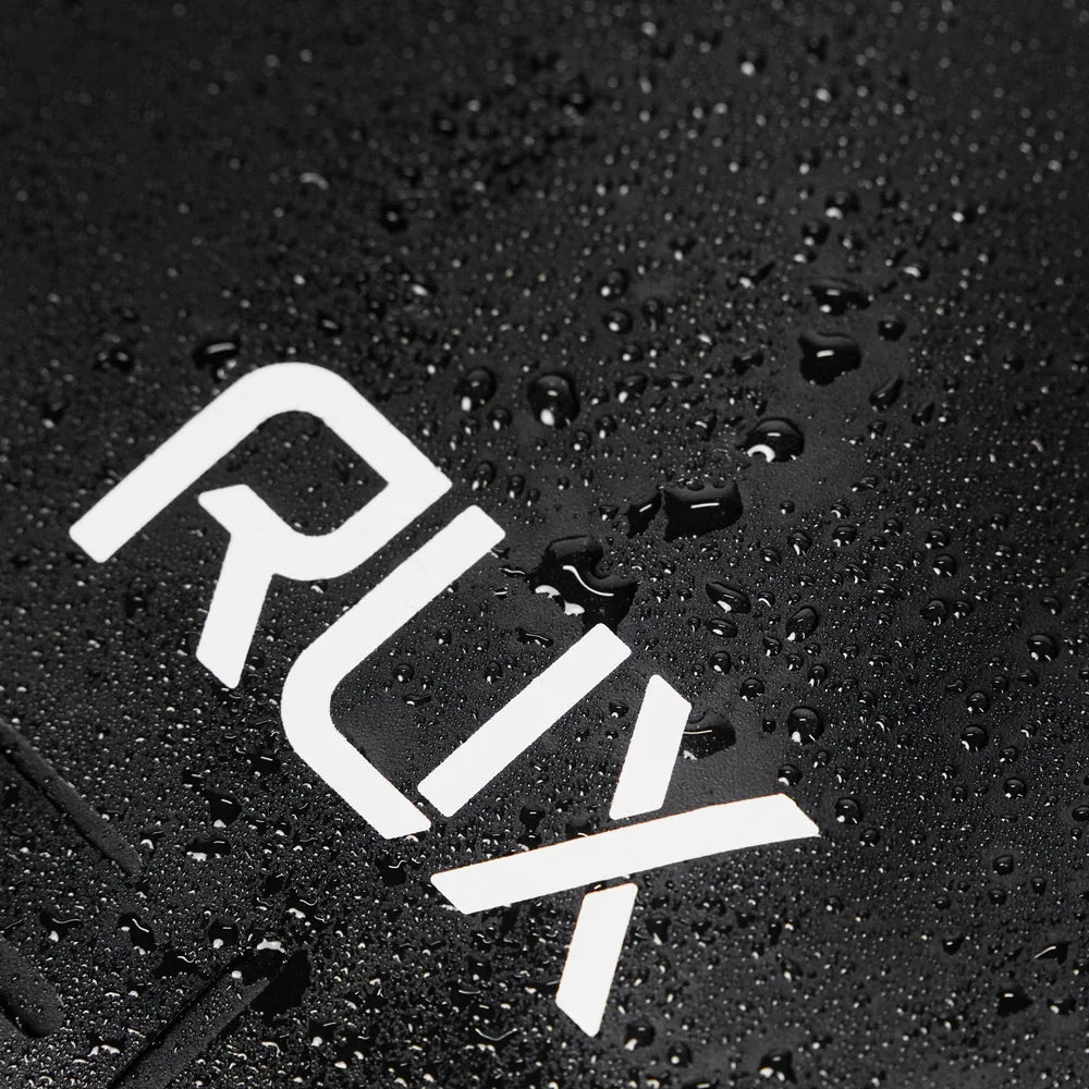 Close-up of water droplets on waterproof RUX tote bag material