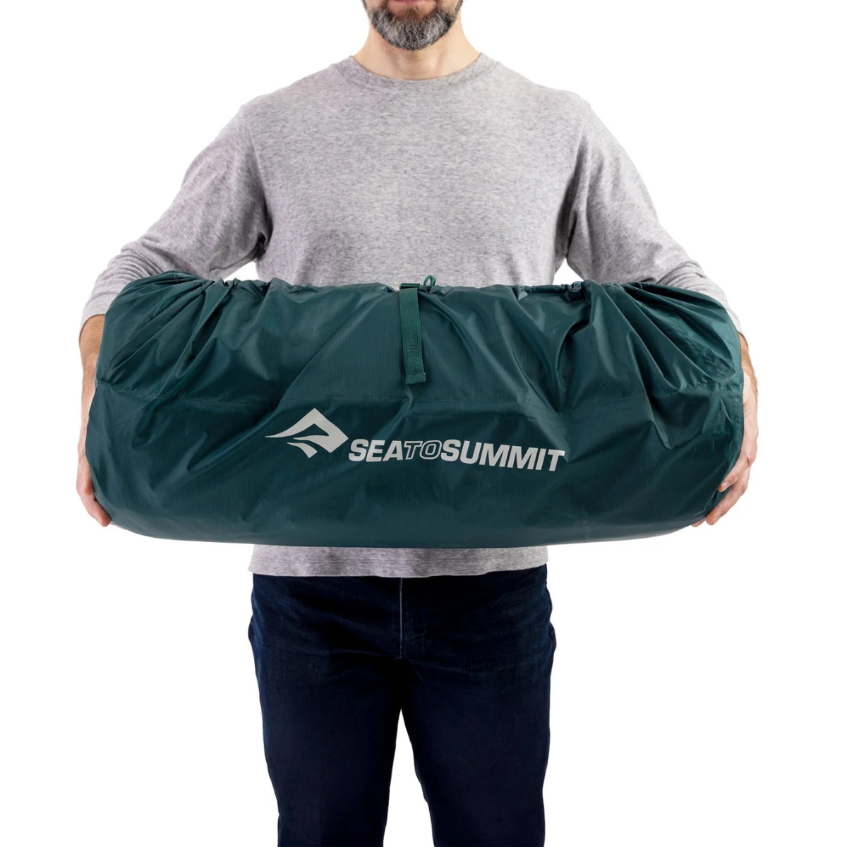 Sea to Summit Comfort Deluxe double wide packed down and held by person