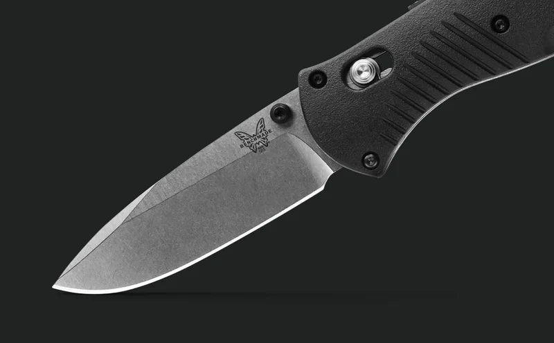 Benchmade Mini Barrage 585 blade angled close-up showing edge grind and Benchmade logo