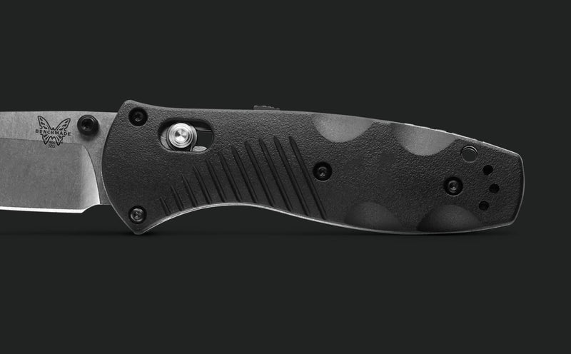 Benchmade Mini Barrage 585 handle close-up showing textured grip pattern and hardware