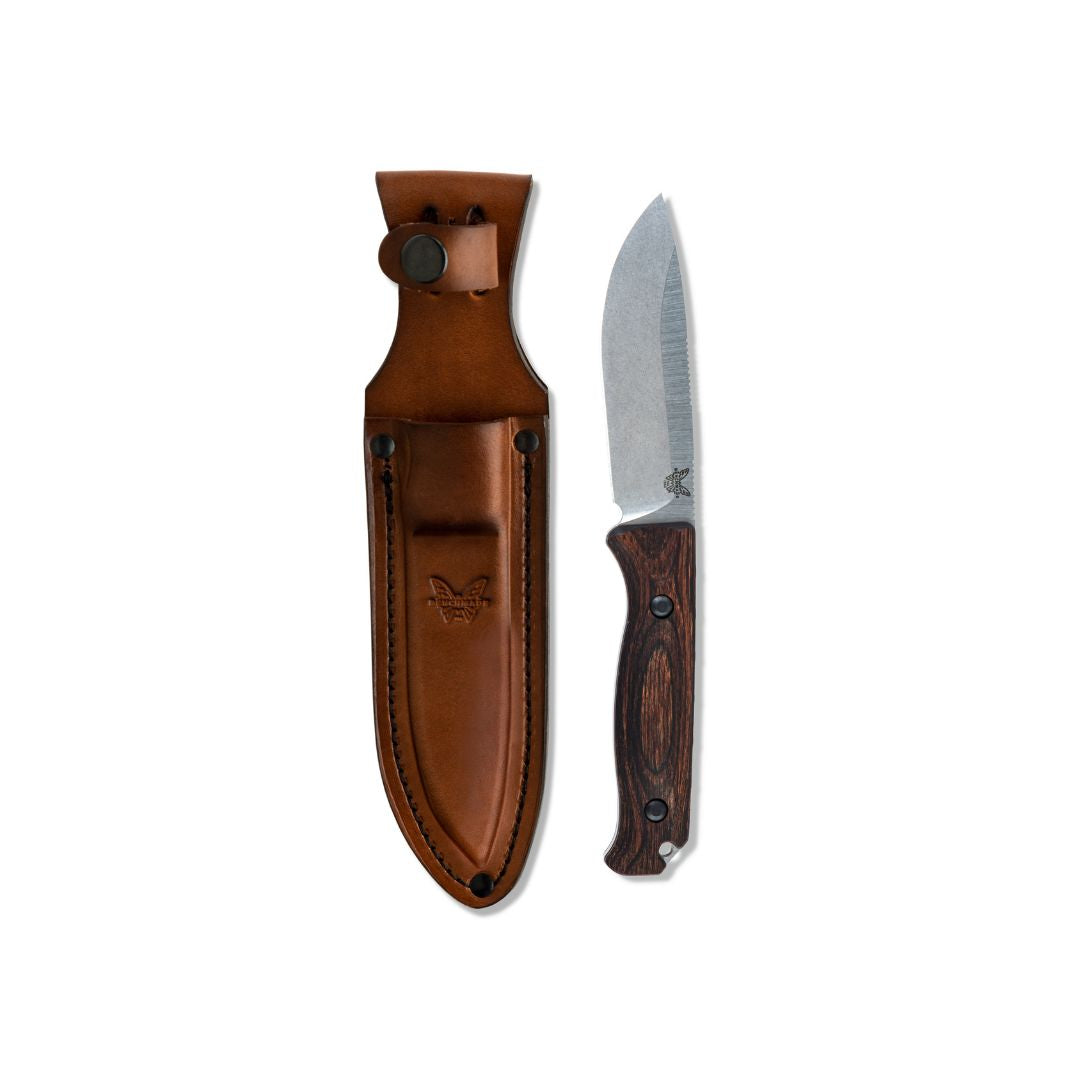 Benchmade Saddle Mountain Skinner knife with leather sheath displayed side by side.