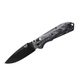 Benchmade Super Freek drop-point knife angled open view highlighting blade and handle texture