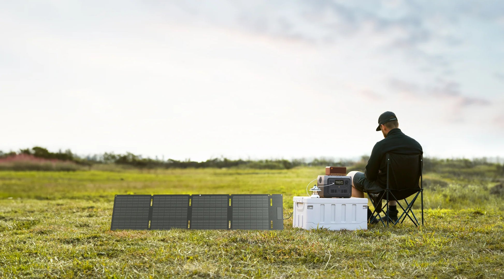 EcoFlow 60W solar panel charging a portable power station in a field