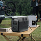 EcoFlow Delta 3 1500 Portable Power Station powering a coffee maker and speaker outdoors near a camper van