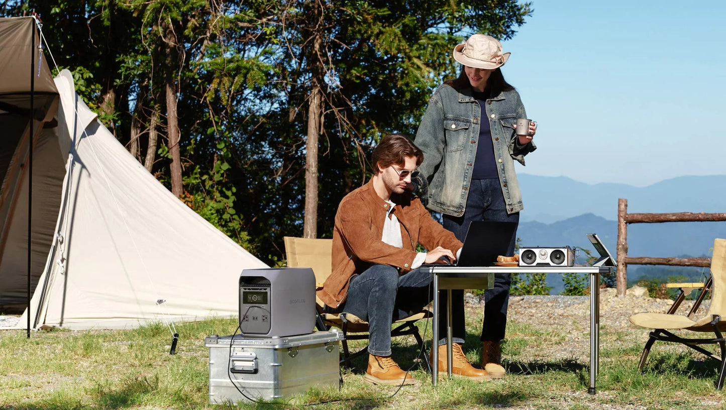 EcoFlow Delta 3 Classic Portable Power Station powering laptops and speakers at a campsite