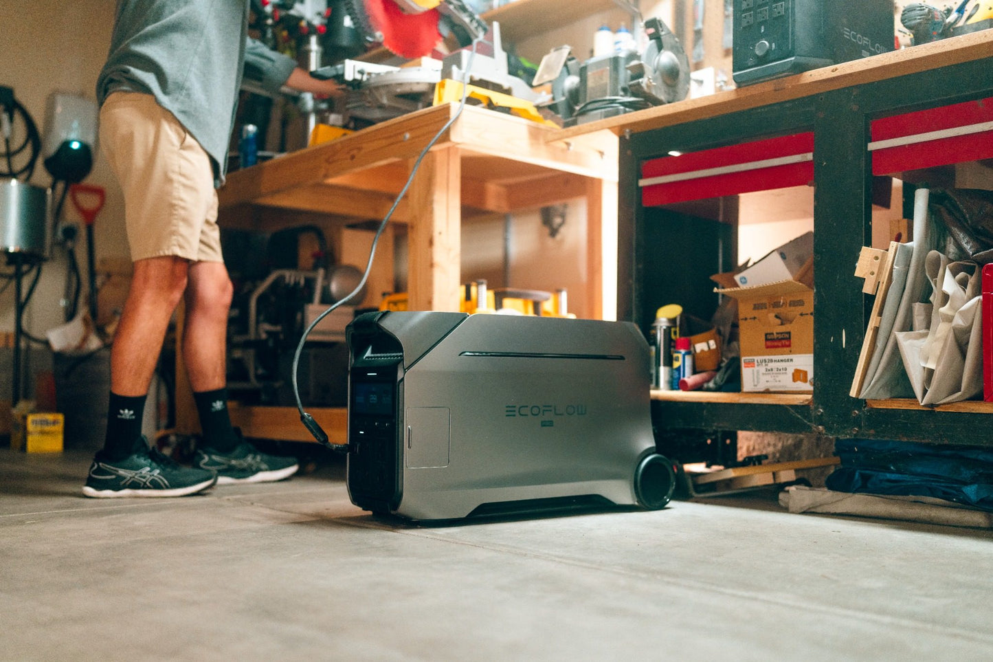 EcoFlow Delta Pro 3 in a lifestyle garage tools left side view setting powering tools.