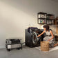EcoFlow Delta Pro Ultra powering a laundry washer in a home utility room as a woman loads clothing.
