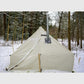 Esker Classic 10x10 winter tent pitched in a snowy forest