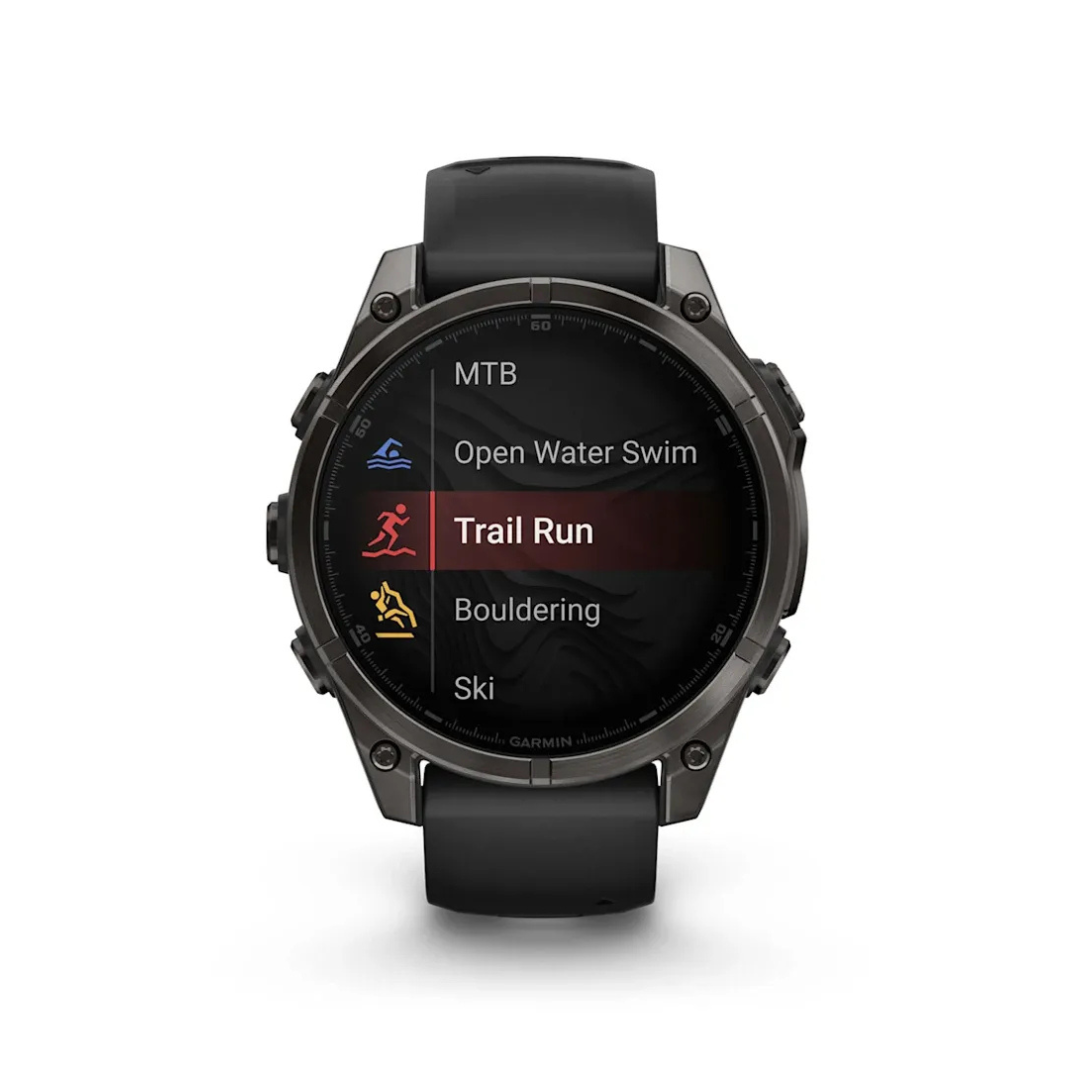 Garmin fēnix 8 smartwatch activity modes menu with trail run MTB ski and swim options on AMOLED display