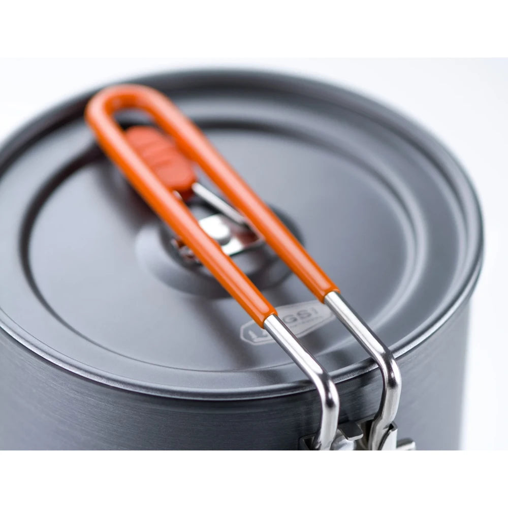 Close-up of GSI Halulite boiler lid and locking handle with orange grip detail