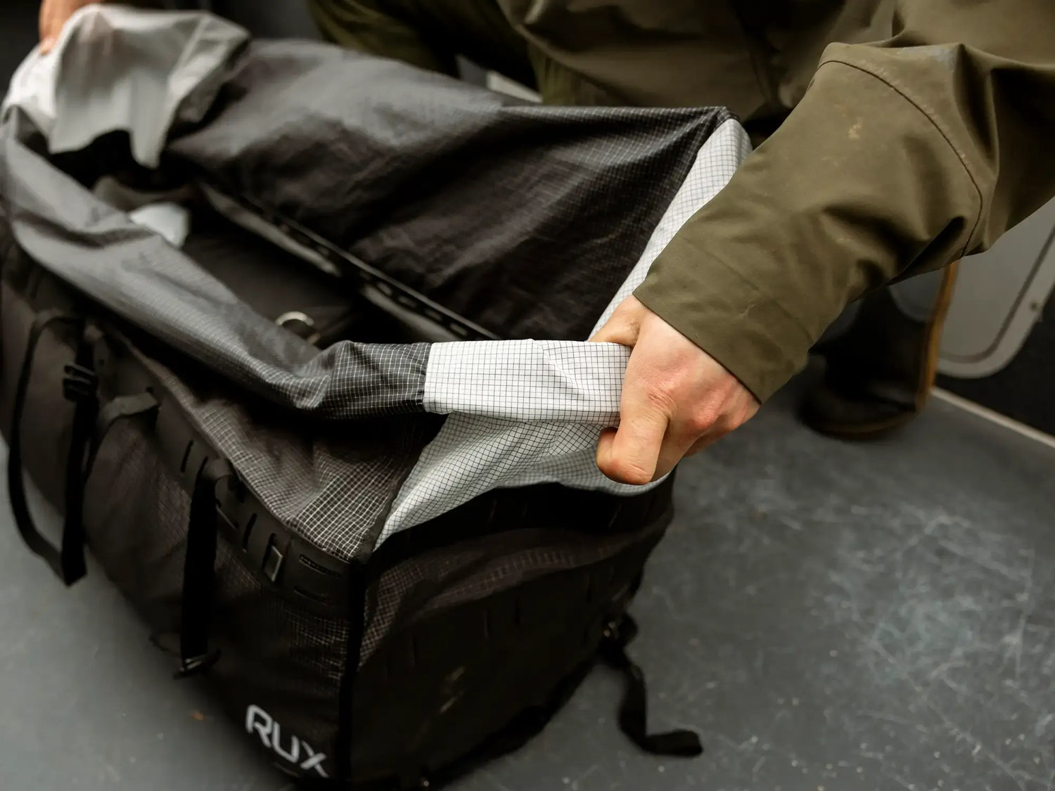 Rux 55L Duffle box showing roll up latch