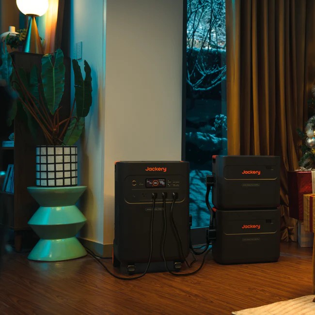Jackery Battery Pack 5000 Plus powering indoor appliances during nighttime use.