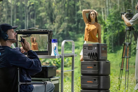 Film crew on a forest set powered by the Jackery HomePower 1000 Plus v2 stacked on expansion batteries