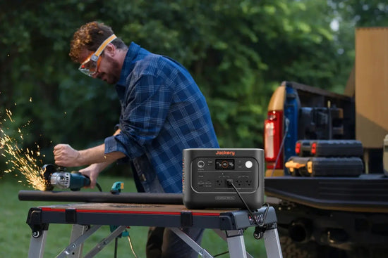 Contractor cutting pipe with an angle grinder plugged into the Jackery HomePower 1000 Plus v2