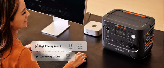 Woman at her desk with the Jackery HomePower 1000 v2 keeping her NAS and Wi-Fi on a high priority circuit