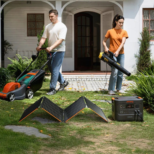 Jackery SolarSaga 340X solar panels powering a portable power station during outdoor yard work.