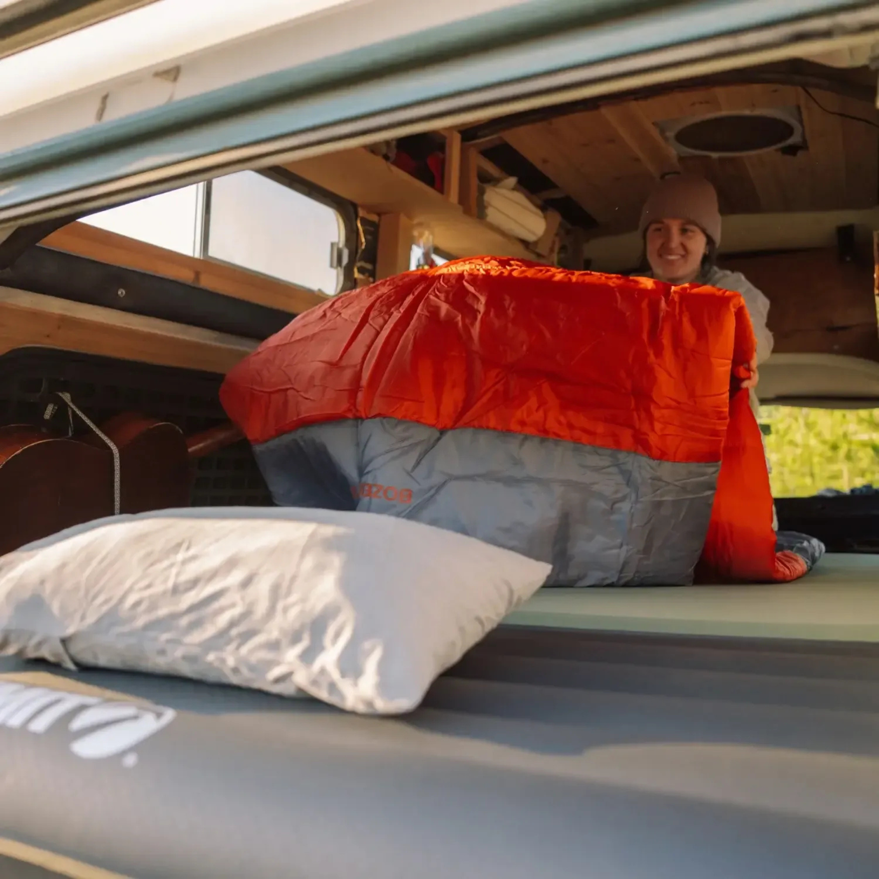Klymit Bozeman 35 Large sleeping bag being used inside camper van for cozy camping setup