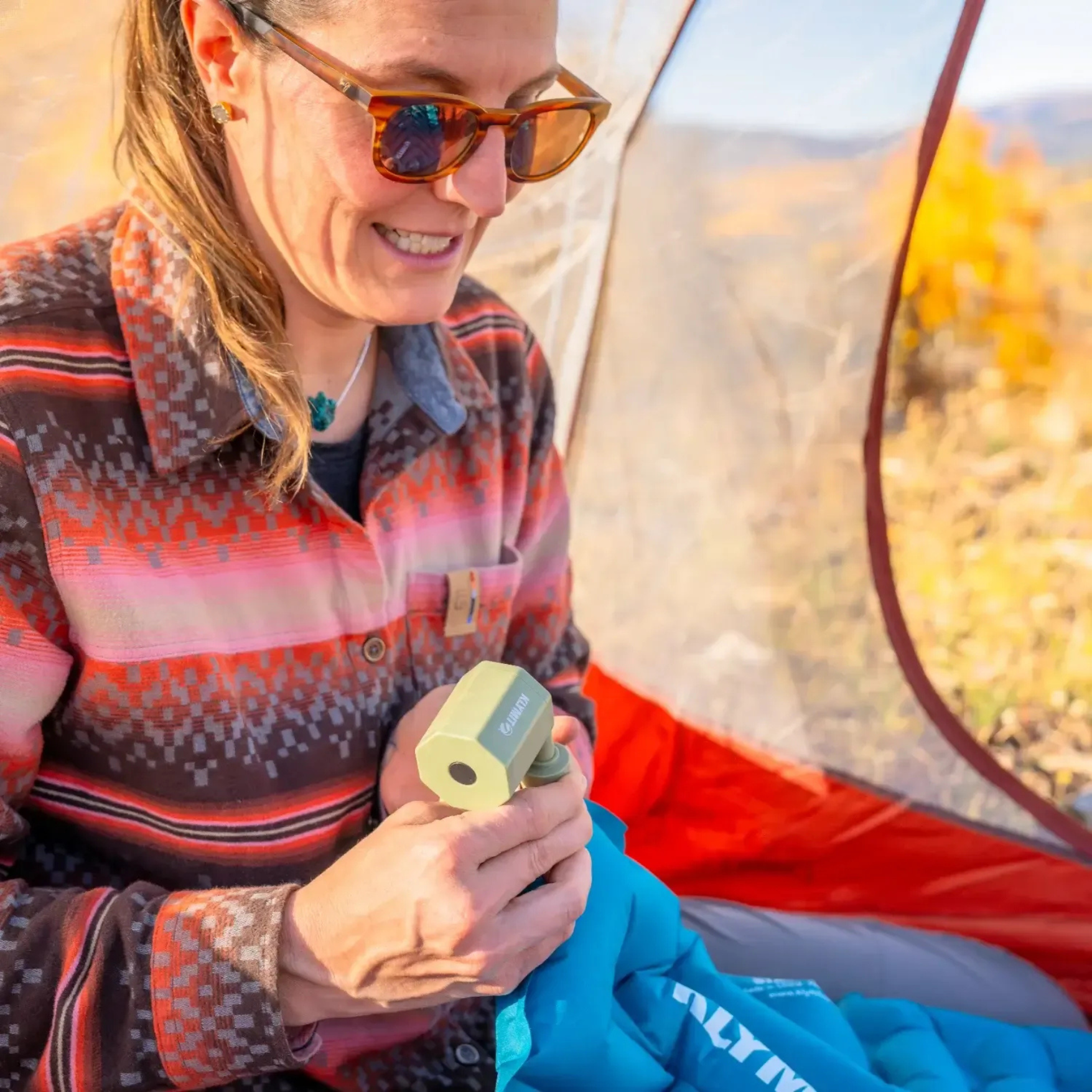 Inflating Klymit Static V Base sleeping pad using pump inside tent
