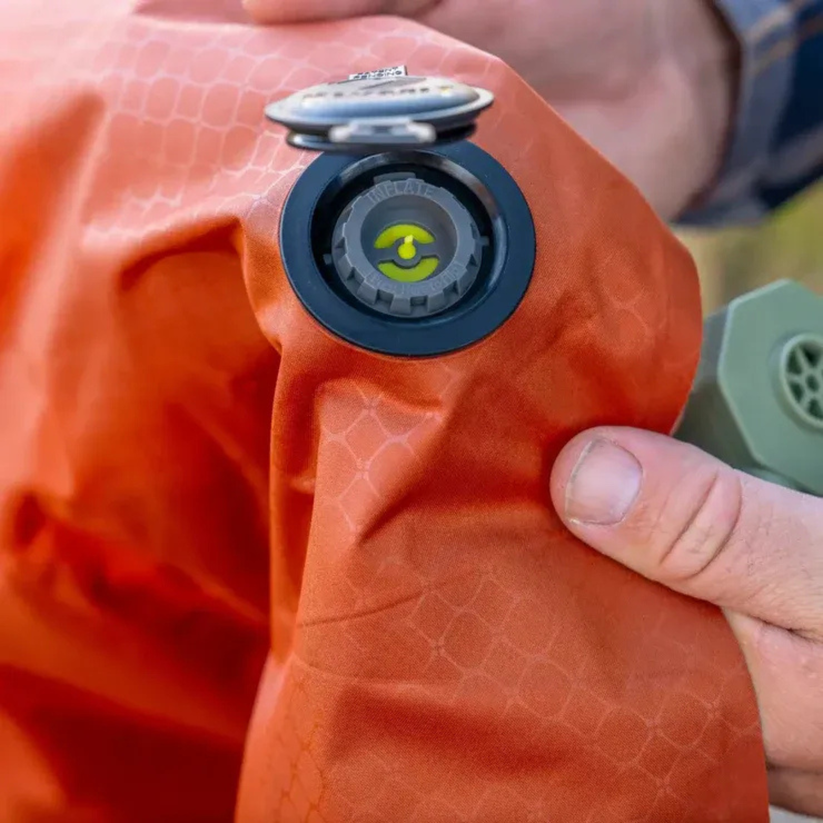 Klymit sleeping pad flip valve close up showing easy inflate and deflate system for camping air mattress