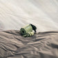 Tempest USB Pump resting on sleeping pad inside tent showing compact portable outdoor design.