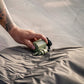 lose-up hand placement using Klymit Tempest USB Pump compact rechargeable air pump on sleeping pad valve.