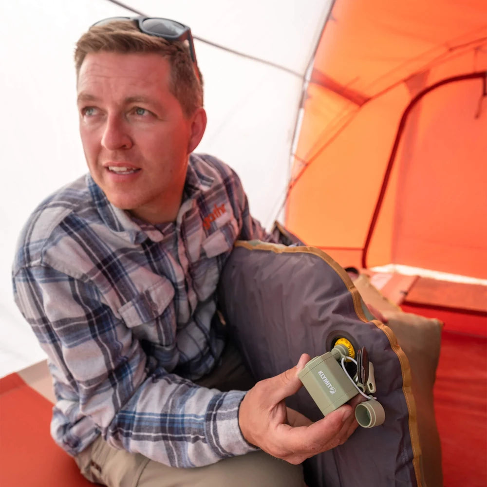 Klymit Tempest USB Pump used inside tent to inflate camping sleeping pad quickly and easily.
