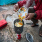 MSR Alpine Plate used as prep plate adding chopped vegetables to camping pot