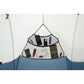 Interior gear pocket of MSR Hubba Hubba HD 1 tent filled with phone, GPS, map, snacks and lip balm showing generous single-person storage organization