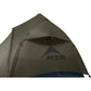 Close-up of MSR Hubba Hubba HD 1 tent rainfly showing kickstand vent opening and MSR mountain logo on olive green 20D ripstop nylon waterproof fabric