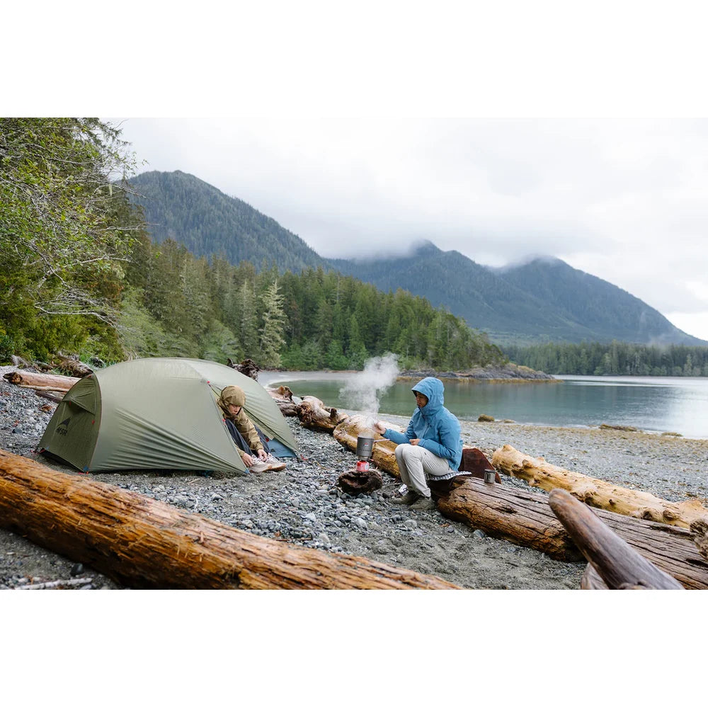 MSR Hubba Hubba HD 2-Person Backpacking Tent pitched at scenic Pacific Northwest lakeside campsite with mountain and forest backdrop on Vancouver Island