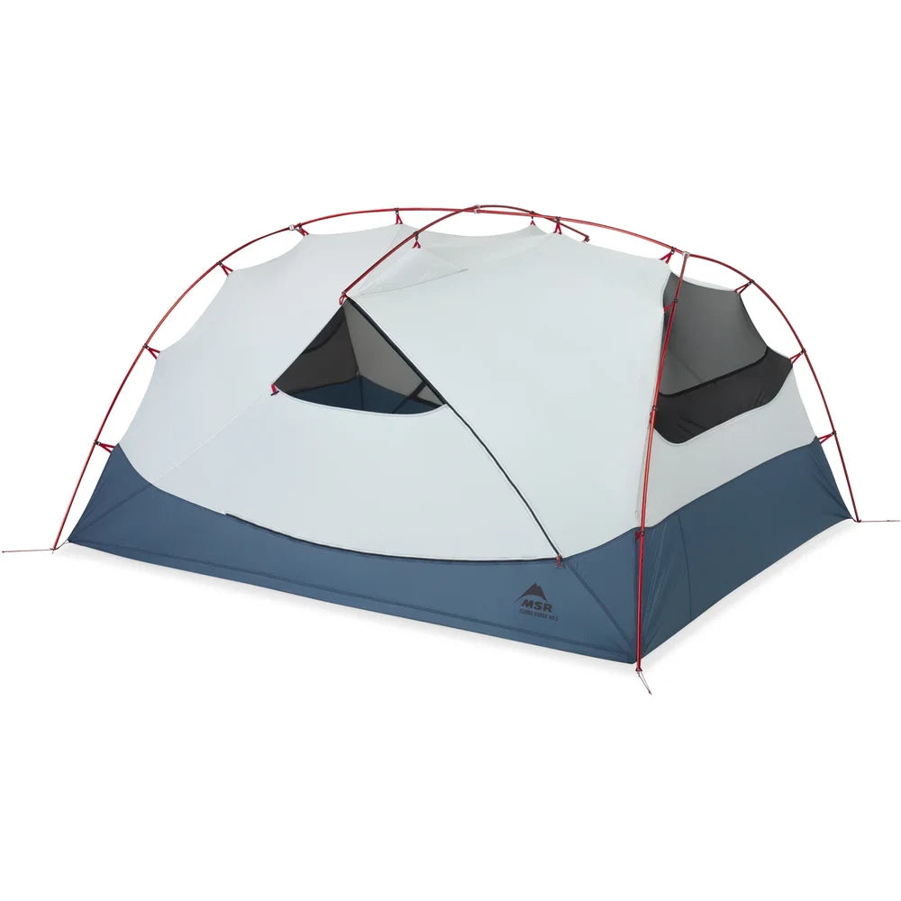 MSR Hubba Hubba HD 3-Person Backpacking Tent pitched at an angle showing full freestanding tent body with red DAC poles and dual doors