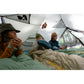 Three campers relaxing inside spacious MSR Hubba Hubba HD 3-Person tent interior with Therm-a-Rest sleeping bags during rainy Vancouver Island backpacking trip