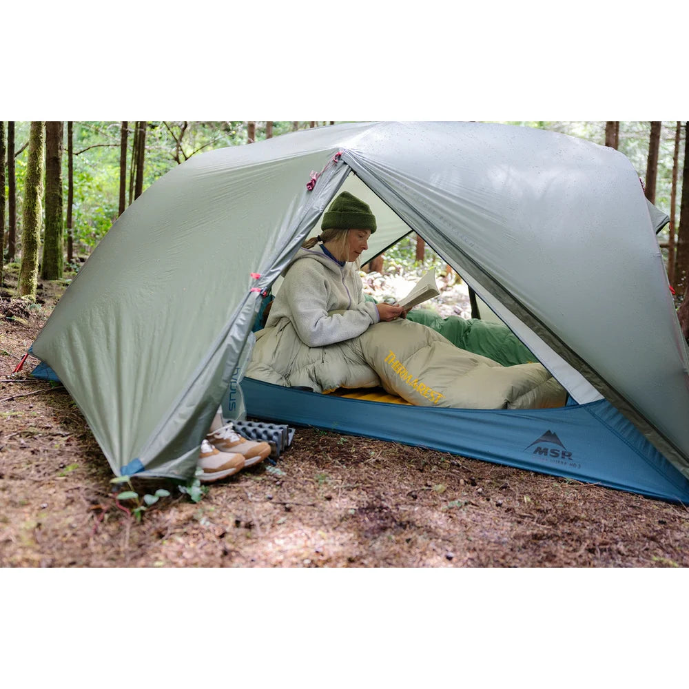 Wide angle view of MSR Hubba Hubba HD 3 tent interior showing three campers with gear loft, ample headroom and 47 sq ft floor space on Vancouver Island