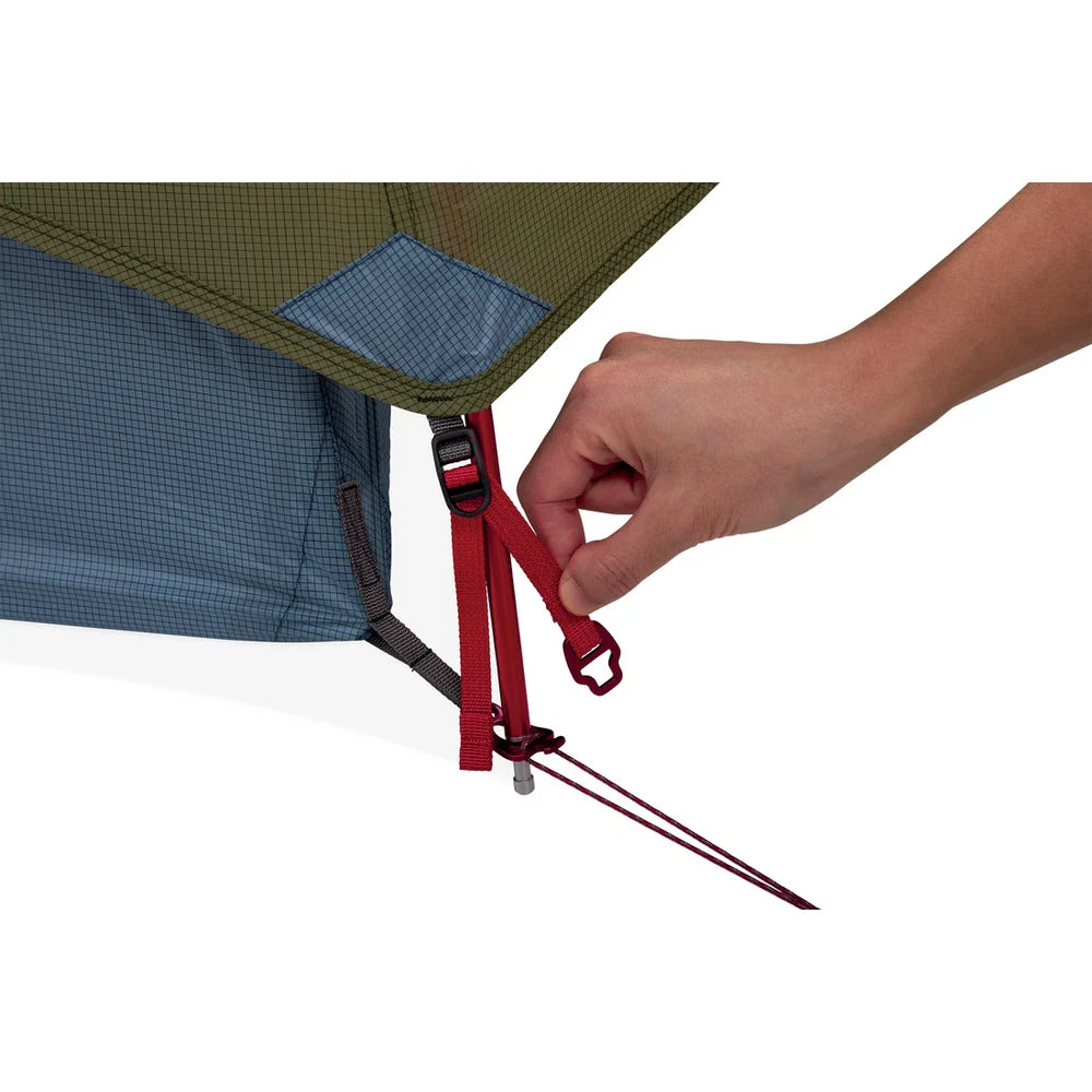 Hand demonstrating MSR Hubba Hubba HD 3 tent easy-clip metal corner hardware and stake loop setup showing quick and intuitive tent pitching system