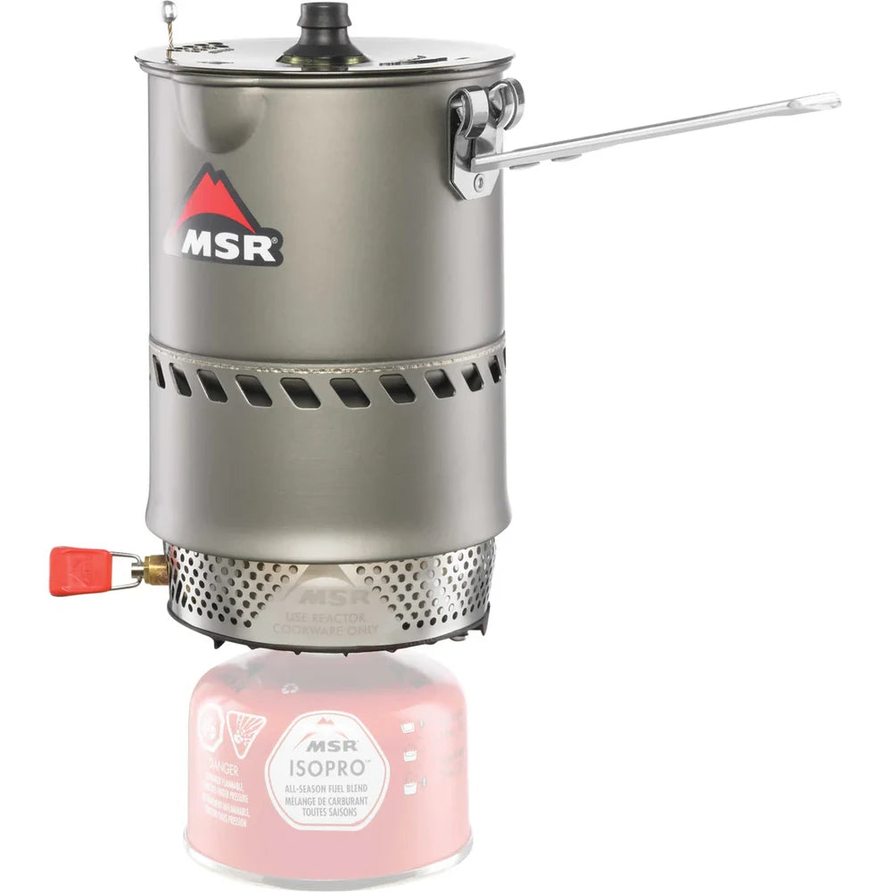 MSR Reactor stove system with pot handle deployed, showing integrated radiant burner and heat exchanger above MSR IsoPro fuel canister on white background