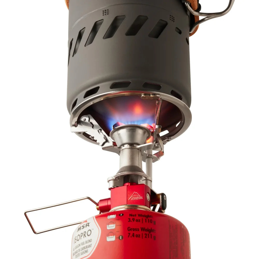 MSR Switch Stove System close up of burner flame and stove connection on fuel canister