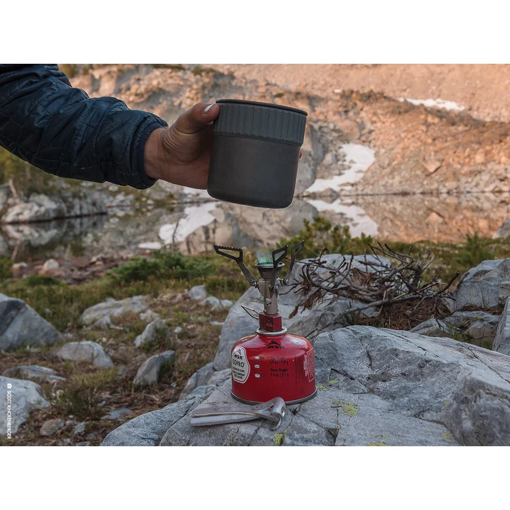 MSR Trail Mini Duo cook set pot on stove with MSR IsoPro fuel canister at basecamp, demonstrating everyday backpacking and outdoor adventure use
