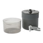 MSR Trail Mini Duo Cook Set on white background showing anodized aluminum pot with strainer lid, MSR folding pot lifter, and clear polycarbonate bowl with measurement markings