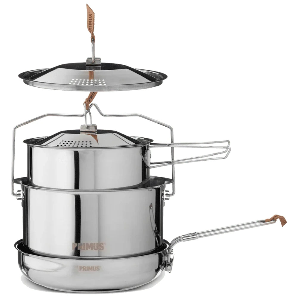 Primus stainless steel camping cook set with pot lid and frying pan on white background