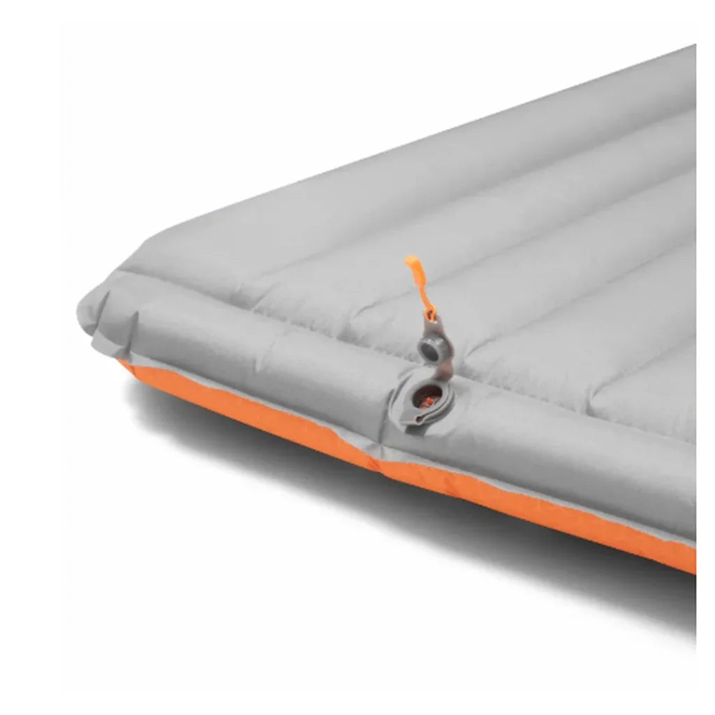 Grey underside of the Rab Hypersphere 9.5 down sleeping mat showing the inflation valve and orange pull tab