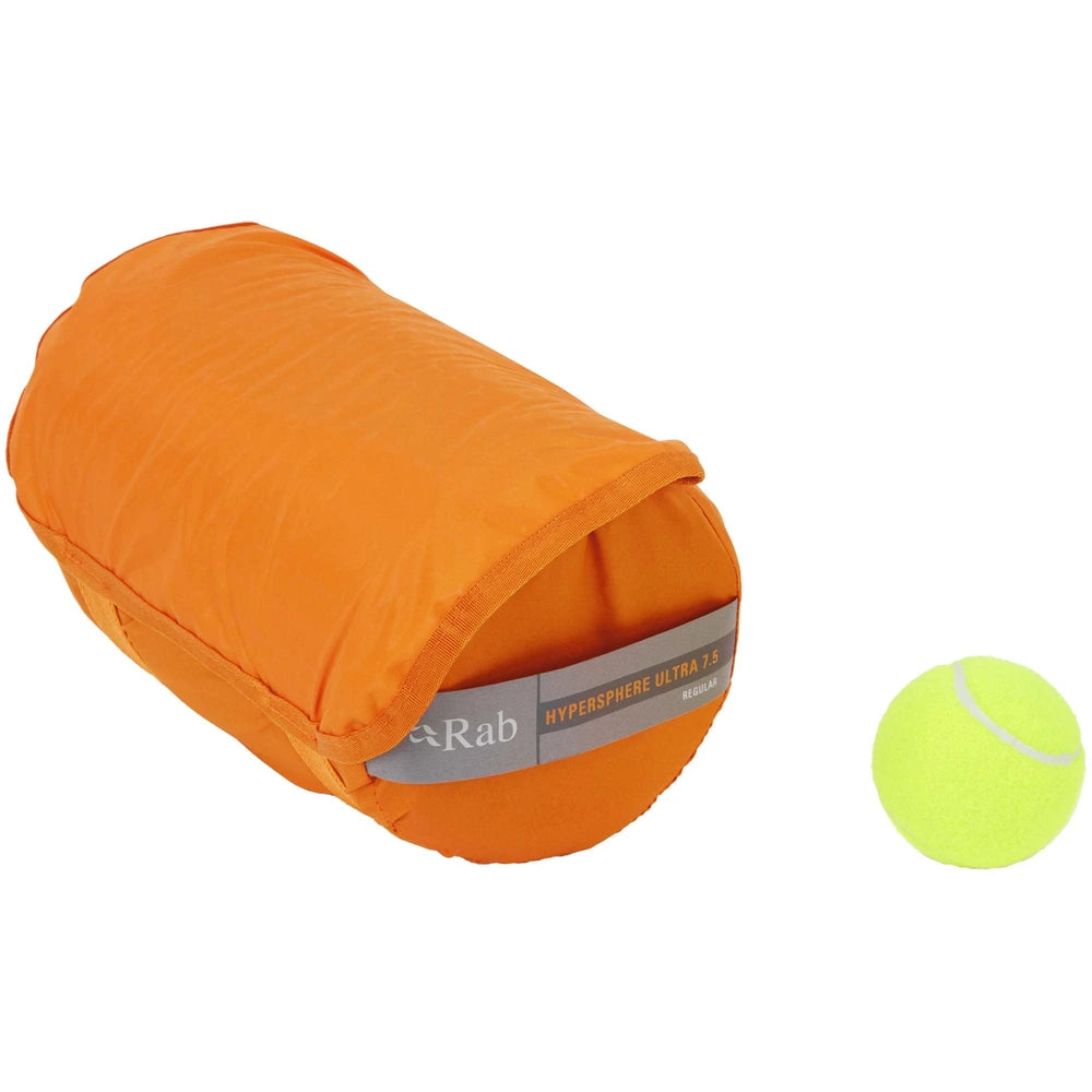 Rab Hypersphere Ultra 7.5 sleeping mat packed size angled view next to tennis ball for scale