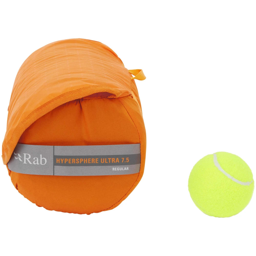 Rab Hypersphere Ultra 7.5 sleeping mat packed in stuff sack next to tennis ball for size reference front view