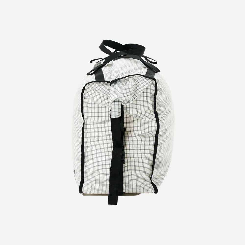 Rux 20L packing bag side view showing compression straps and compact storage profile