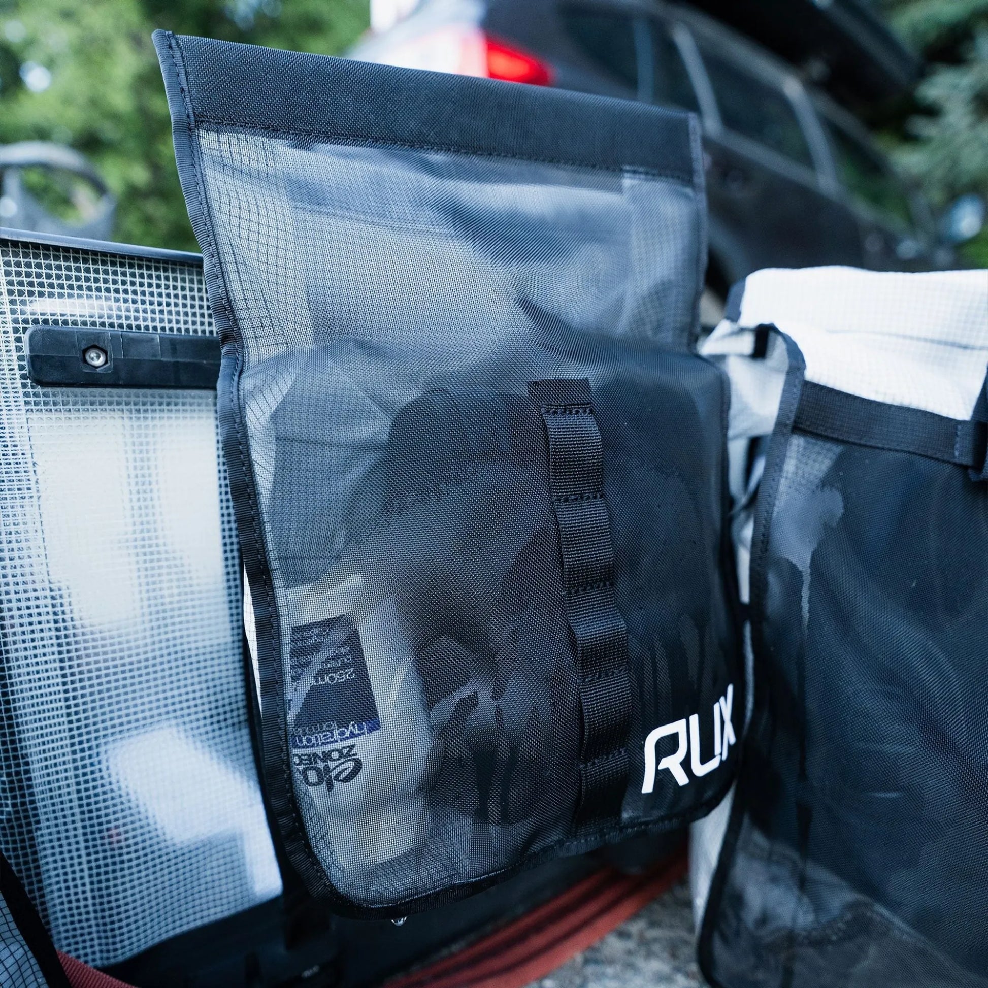 Rux 2L Packing Pocket Mesh attached to gear system with outdoor equipment inside