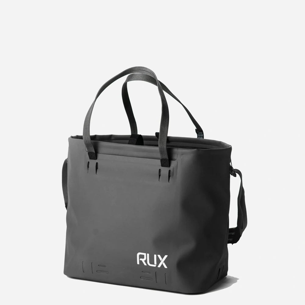 RUX 30L Waterproof Tote in black, black waterproof tote front left straps up product image on white background