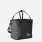 RUX 30L Waterproof Tote in black, black waterproof tote front 34 right straps up product image on white background