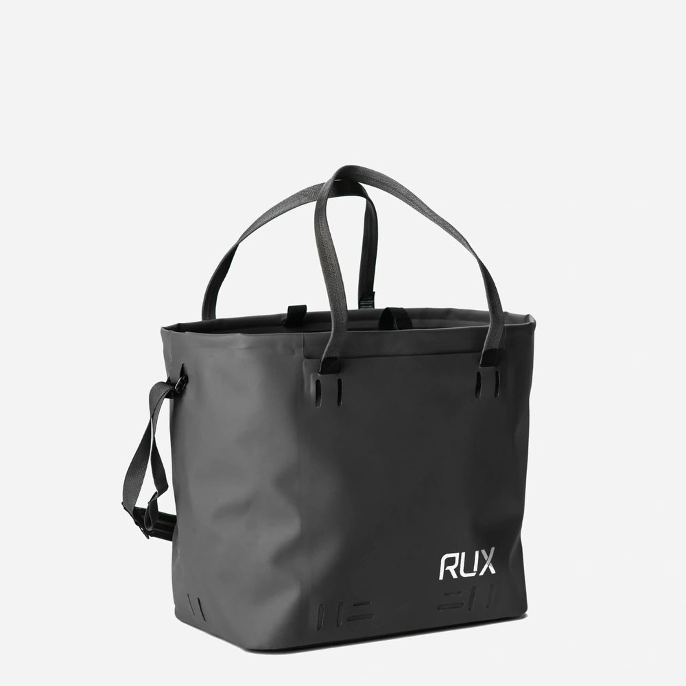 RUX 30L Waterproof Tote in black, black waterproof tote front 34 right straps up product image on white background