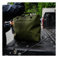 RUX 30L Waterproof Tote in green shown outdoors on truck tailgate
